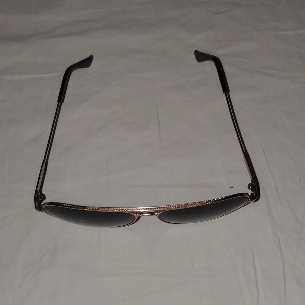 Cole Haan gold aviator sunglasses with dark lenses. Polarized.